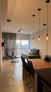a living room with a bed and a table at BACO at HOME in Corrientes
