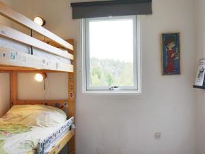 Кровать или кровати в номере 4 star holiday home in Rabbalshede-By Traum