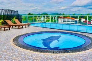 a dolphin in the middle of a swimming pool at The Pharo in Nittambuwa