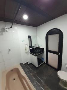 Ett badrum på El cafetero hospedaje