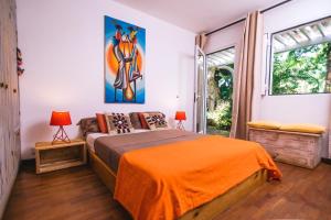 Postel nebo postele na pokoji v ubytování Tree Lodge Mauritius