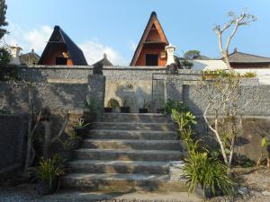 a set of stairs leading up to a house at Candra Homestay Besakih in Besakih