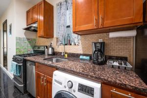 a kitchen with a sink and a dishwasher at Perfect Chic Apartment in Upper West of NYC! in New York
