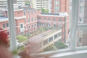 a view from a window of a city with buildings at Datong Elite Apartment, Peoples Square, CBD in Shanghai