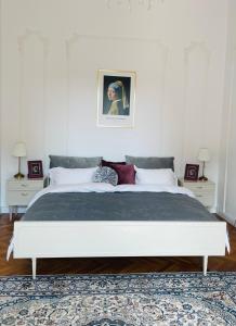 a bedroom with a large bed with two night stands at LittleParis in Cluj-Napoca