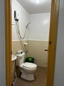 a small bathroom with a toilet and a sink at Cebu City 2 Bedroom Condo Unit-WIFI-A/C-Hot Shower (U404) in Cebu City