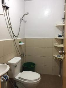 a bathroom with a toilet and a sink at Cebu City 2 Bedroom Condo Unit-WIFI-A/C-Hot Shower (U404) in Cebu City