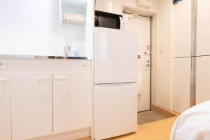 Kuchyň nebo kuchyňský kout v ubytování AZEST-RENT Haneda 11