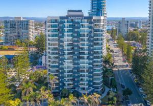 an aerial view of a tall building in a city at Baronnet Apartments in Gold Coast