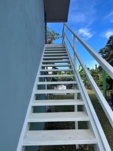 a staircase leading up to a house at ShaBere in Talamanca