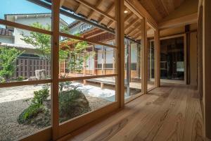 a view from the inside of a house with a large window at NIPPONIA平福宿場町 in Sayo