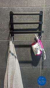 a pair of towels hanging on a towel rack at Nyskie Ustronie in Nysa