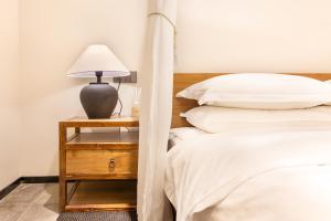 Letto o letti in una camera di Yangzhou Aihehua Boutique Homestay