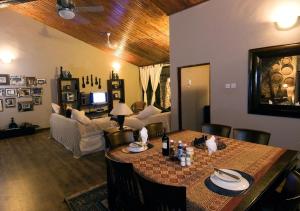 a living room with a table and a couch at Zi Villa Main House in Matemwe