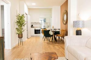 a living room with a couch and a table at SUITE 1907 OVIEDO COLLECTION in Oviedo