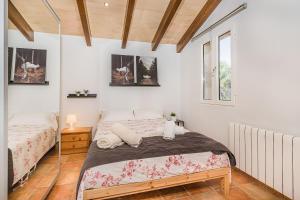 Postel nebo postele na pokoji v ubytování Can Porxet + 26 fotografií
