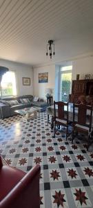 a living room with a checkered floor at La Garenne in Virazeil