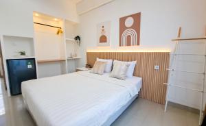 Postel nebo postele na pokoji v ubytování Olivia SOHO Guest House