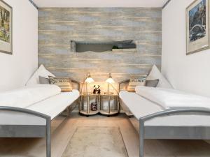 Ένα ή περισσότερα κρεβάτια σε δωμάτιο στο Residenz am Yachthafen Muschelsucher