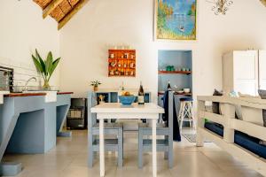 a kitchen with a white table in a room at Oude Compagnies Post in Tulbagh