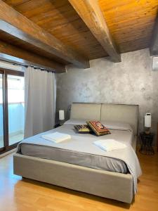 a bedroom with a bed with two books on it at VeraHouse in Palermo