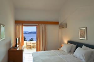 Postel nebo postele na pokoji v ubytování Kanapitsa Mare Hotel