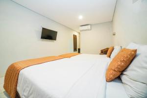 Voodi või voodid majutusasutuse Hotel Kalisma by Alia toas