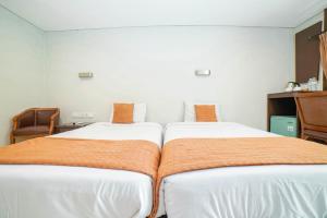 Voodi või voodid majutusasutuse Hotel Kalisma by Alia toas
