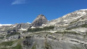 a rocky mountain with a blue sky in the background at Fortuna 403 in Leukerbad