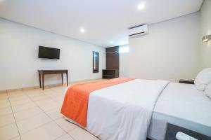Voodi või voodid majutusasutuse Hotel Kalisma by Alia toas