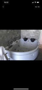 a white bath tub in a bathroom with a sink at Paraíso sobre el Mar Torremolinos Santa Clara in Torremolinos