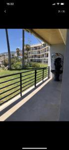 a balcony of a building with a building in the background at Paraíso sobre el Mar Torremolinos Santa Clara in Torremolinos