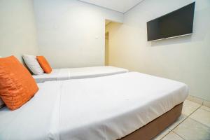 Voodi või voodid majutusasutuse Hotel Kalisma by Alia toas