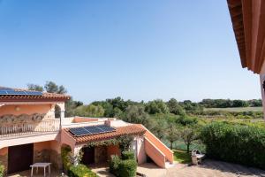 a view of a house with solar panels on the roof at Sardegnadream in San Teodoro +145 photos