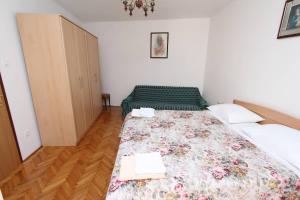 Postel nebo postele na pokoji v ubytování Apartments Milka