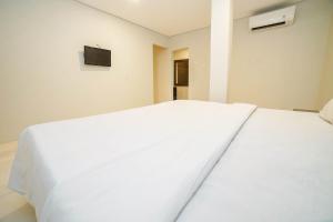 Voodi või voodid majutusasutuse Hotel Kalisma by Alia toas