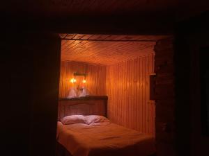 A bed or beds in a room at Qusha Guesthouse Meeting in the mountains and views
