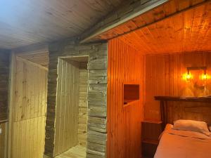 A bed or beds in a room at Qusha Guesthouse Meeting in the mountains and views