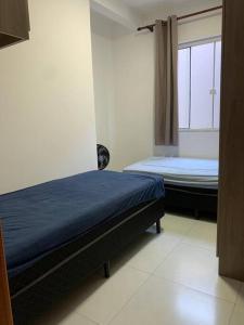 Un pat sau paturi într-o cameră la Sonho de Praia - 03 qtos a 350metros do Mar