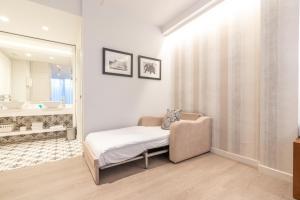 Posteľ alebo postele v izbe v ubytovaní Serennia Fira Gran Via Exclusive Rooms