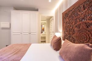 Posteľ alebo postele v izbe v ubytovaní Serennia Fira Gran Via Exclusive Rooms