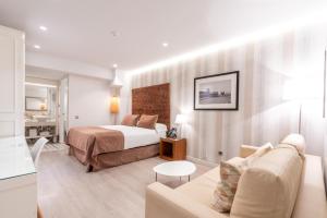 Posteľ alebo postele v izbe v ubytovaní Serennia Fira Gran Via Exclusive Rooms