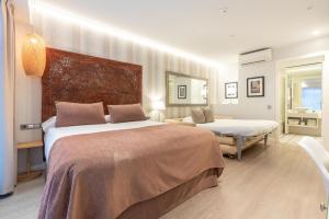 Posteľ alebo postele v izbe v ubytovaní Serennia Fira Gran Via Exclusive Rooms