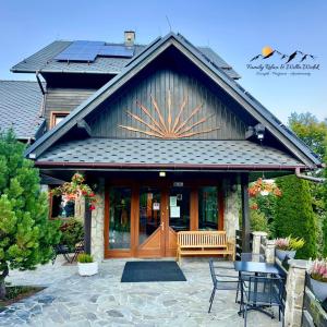 a house with solar panels on the roof at Family Relax & Willa Widok in Szczyrk