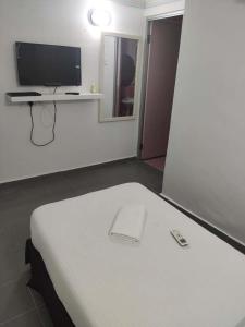 TV a/nebo společenská místnost v ubytování Vive Inn + 7 fotografií