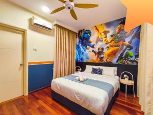 a bedroom with a superhero mural on the wall at Medini Signature Ninjago Suites in Nusajaya