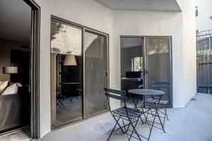 a balcony with a table and chairs and a bedroom at Westwood 1br close to UCLA LAX-1141 in Los Angeles