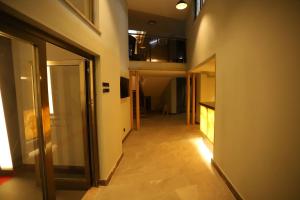 an empty hallway with a hallway leading to a room at Peramis Hotel & Spa in Antalya