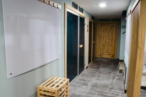 a hallway of a building with a door and a bench at Peramis Hotel & Spa in Antalya
