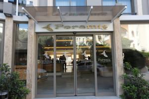 a restaurant entrance with a sign that reads pennants at Peramis Hotel & Spa in Antalya